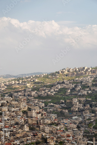 Aerial cityscape view of Jabal Batin alHawa residential neighborhood during a cloudy day. Taken in Jerusalem, Israel.