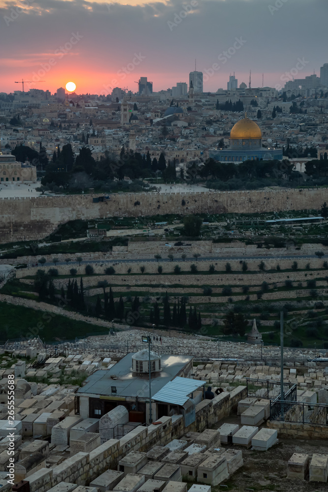 Beautiful aerial view of the Old City, Dome of the Rock and Tomb of the Prophets during a dramatic sunset. Taken in Jerusalem, Capital of Israel.