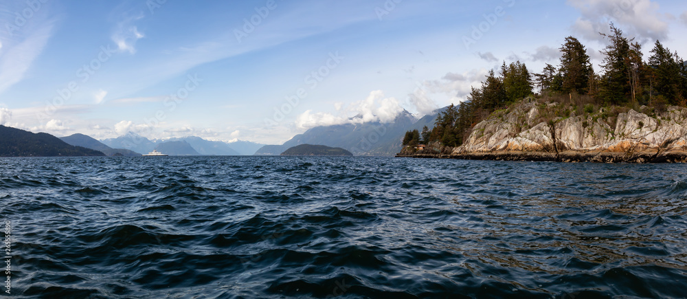Beautiful panoramic view of Canadian Landscape at the Pacific Ocean Coast in Howe Sound during a cloudy day. Taken in Horseshoe Bay, West Vancouver, BC, Canada.