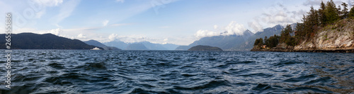 Beautiful panoramic view of Canadian Landscape at the Pacific Ocean Coast in Howe Sound during a cloudy day. Taken in Horseshoe Bay, West Vancouver, BC, Canada.