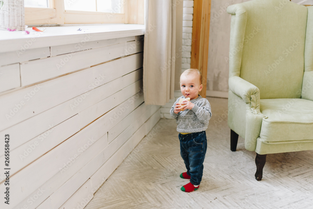 Cute little toddler boy snacking standing Cute little toddler boy snacking standing
