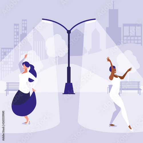 young interracial girls dancing in the park
