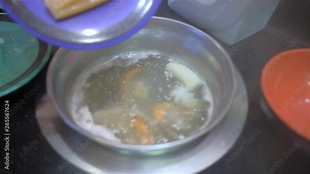 Slow motion of People enjoy eating Shabu and add squid in hot soup at japanese restaurant Slow motion of People enjoy eating Shabu and add squid in hot soup at japanese restaurant