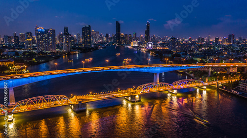 Aerial view Bangkok city skyline and skyscraper at night with business building in Bangkok downtown  Chao Phraya River  Bangkok  Thailand.