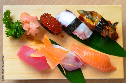 Sushi set on wooden plate photo