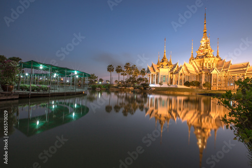 Wallpaper Wat Lan Boon Mahawihan Somdet Phra Buddhacharn(Wat Non Kum)is the beauty of the church that reflects the surface of the water, popular tourists come to make merit and take a public photo photo