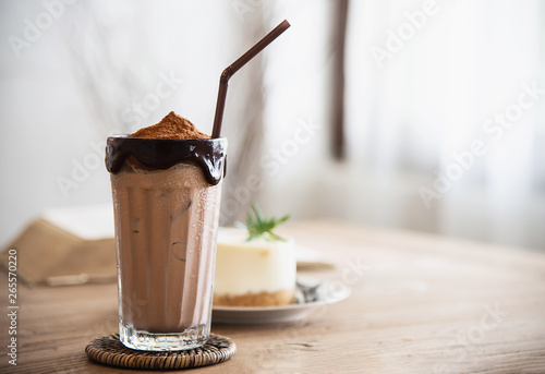 Cocolate cocoa blend with cake in coffee shop - dessert background concept photo