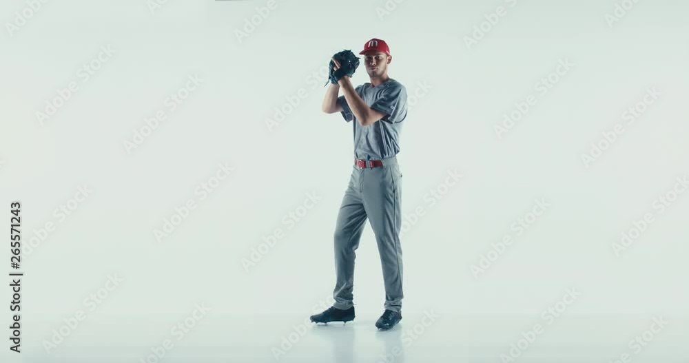 Caucasian professional baseball player pitcher throwing a ball towards camera isolated on white background. 4K UHD 60 FPS SLOW MOTION Caucasian professional baseball player pitcher throwing a ball towards camera isolated on white background. 4K UHD 60 FPS SLOW MOTION
