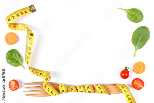 Frame of fork with centimeter and vegetables  slimming and healthy nutrition concept  copy space for text on white