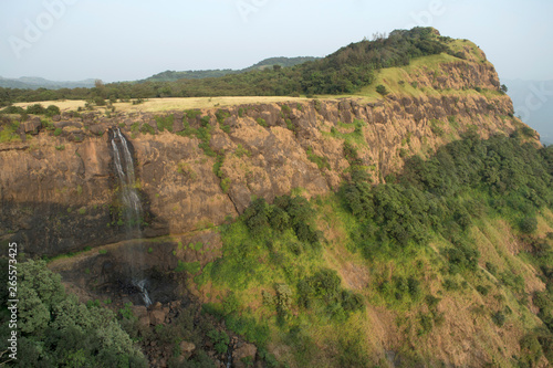 Landscape view of a waterfall and mountain near Made Ghats, Pune Maharashtra photo