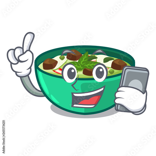 With phone green churry served in cartoon bowl