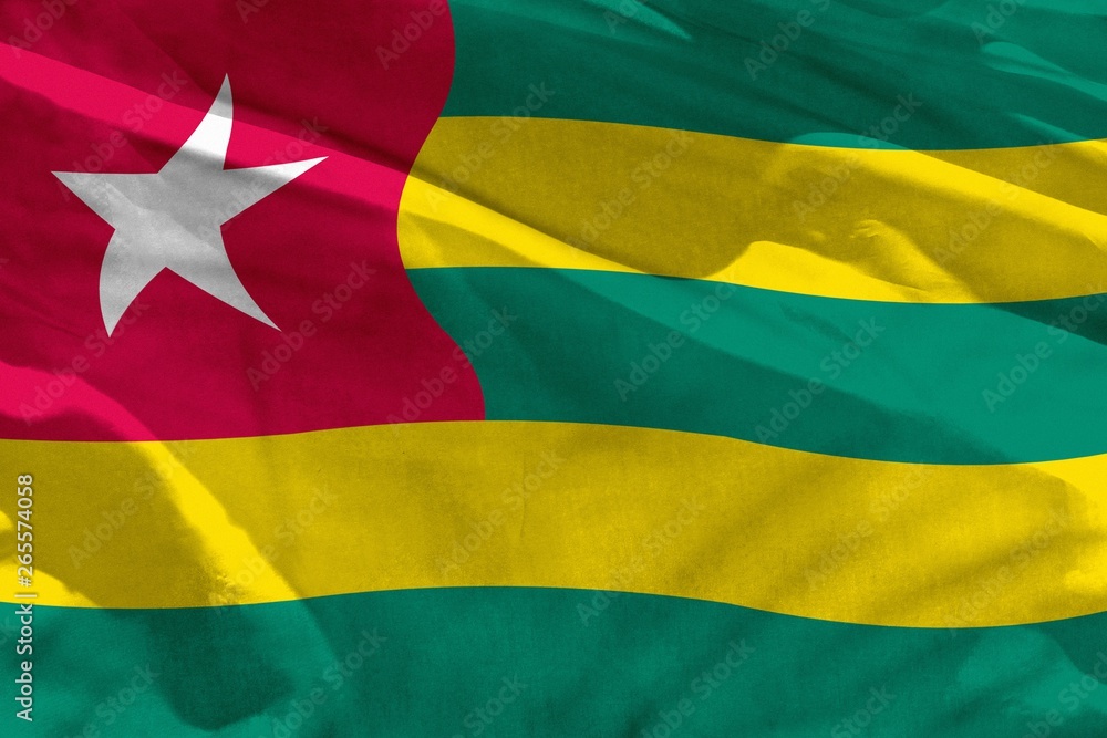 Waving Togo flag for using as texture or background, the flag is fluttering on the wind