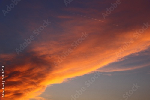 pretty colorful sun colored clouds in the sky for using in design as background. © Dancing Man