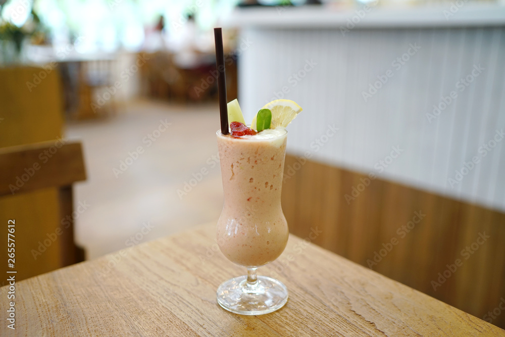 Glass of Fresh strawberry smoothie mixed with yogurt and avocado on wooden table, Healthy drink concept. Glass of Fresh strawberry smoothie mixed with yogurt and avocado on wooden table, Healthy drink concept.