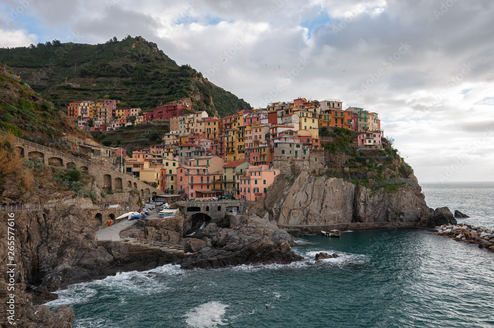 Manarola in the Cinque Terre, Italy. Beautiful seaside town and fishermen, a popular tourist destination for sea holidays and tracking in unspoiled nature.