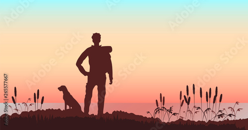 man with a dog on the background of the river landscape. landscape at sunset