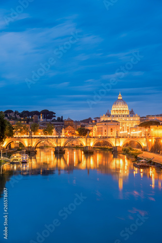 Travel in Rome ,Sunset view of Rome St. Peters Basilica in the Vatican and the Ponte Sant'Angelo, Bridge of Angels, at the Castel Sant'Angelo and river Tiber in Rome, Italy, © martinhosmat083