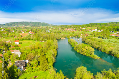 Croatia, green countryside, Mreznica river from air, panoramic view of Belavici village, waterfalls in spring, popular tourist destination