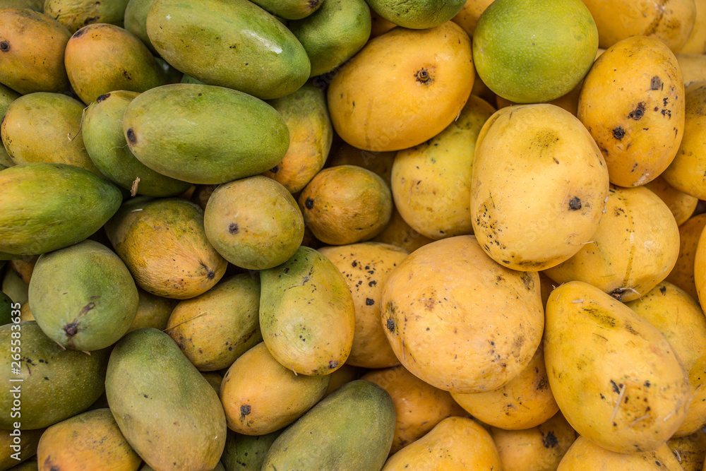 A bunch of organic mangoes filling the frame