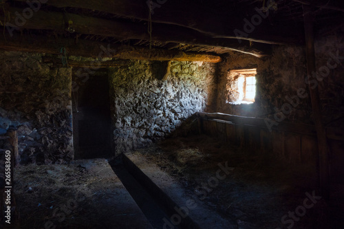 Interior of an ancient rural stable in northern Italy