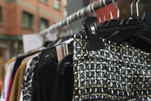 Street flea market. vintage clothes on the rack