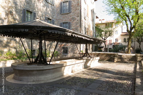 An ancient little square in Bergamo Alta the upper town  where people use to hand wash their clothes. It is a historical place with a fairy tale atmosphere remained unchanged from the past old days