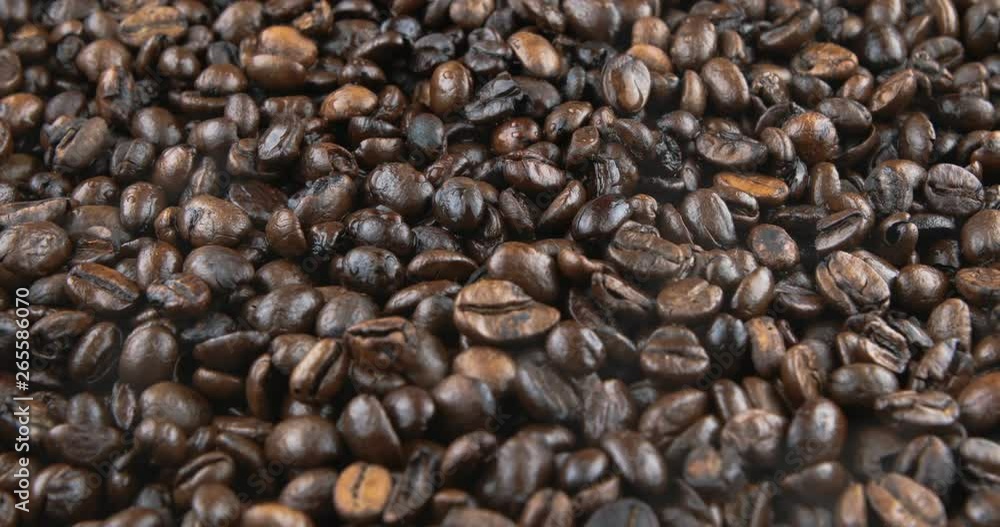 Coffee beans are roasted in a frying pan Coffee beans are roasted in a frying pan