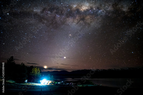 Fototapeta Naklejka Na Ścianę i Meble -  Beautiful milky way, starry night over the snow mountain at Lake Pukaki, New Zealand. High ISO Photography.