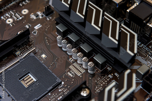 Computer motherboard on dark background, close up