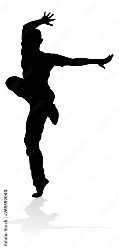 A male street dance hip hop dancer in silhouette A male street dance hip hop dancer in silhouette