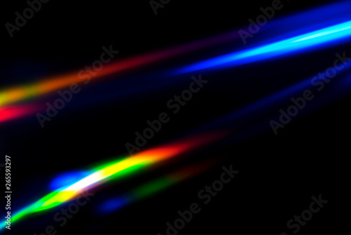 Abstract colorful spectrum in darkness. Colorful rays of light.