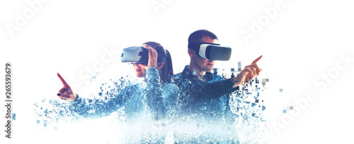 Obraz na płótnie A man and a woman in glasses of virtual reality. The concept of modern technologies and technologies of the future. Fragmented by pixels. VR glasses. w salonie