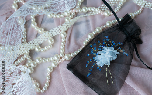 Fototapeta Naklejka Na Ścianę i Meble -  Wedding background with pearls and hair accessories on pink background