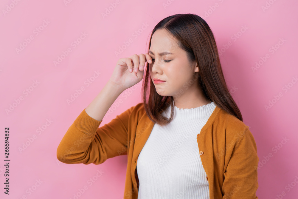 Asian girl is crying ,sad concept indoor pink studion Asian girl is crying ,sad concept indoor pink studion