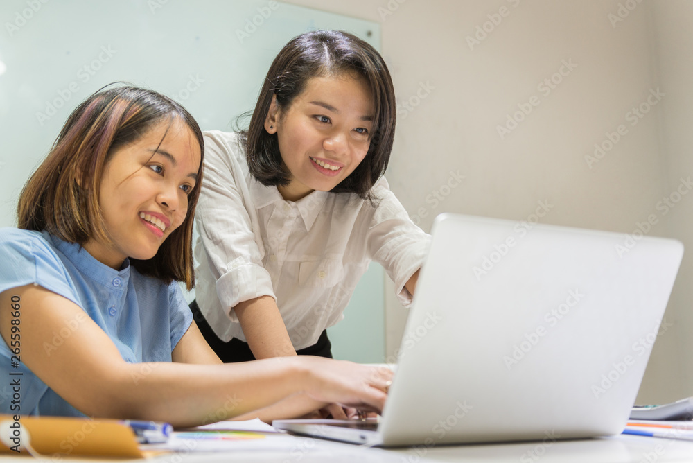 Asian employees working together in a team Asian employees working together in a team