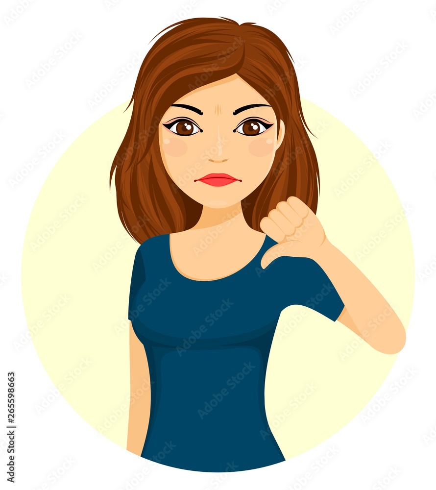 A young girl is pointing her thumb down with displeasure. A young girl is pointing her thumb down with displeasure.