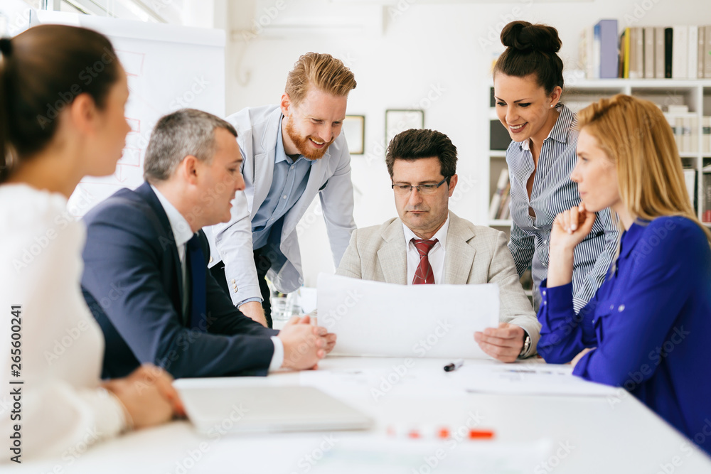 Group of business people working as team in office