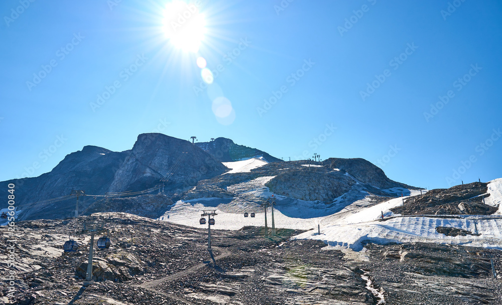 Ski area of "Hintertux" in Austria at 3250 m altitude at summertime / one of only two ski resorts in the world offering skiing 365 days a year - obrazy, fototapety, plakaty 