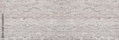 Wide light brick wall texture. Rough brickwork panoramic vintage background