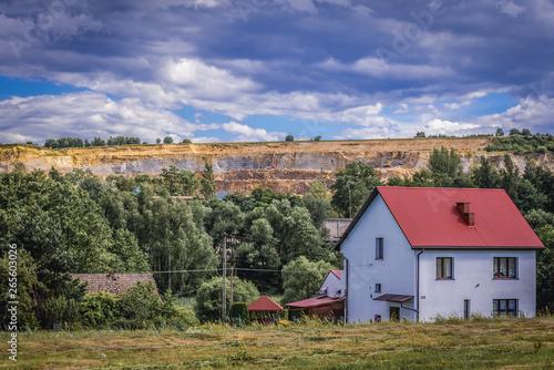 View on the house with porphyry mine on background in Zalas, small village near Cracow, Poland © Fotokon