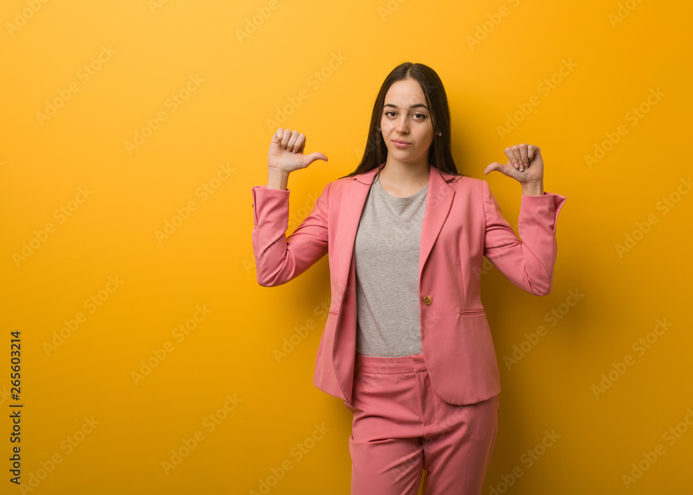 Young modern business woman pointing fingers, example to follow Young modern business woman pointing fingers, example to follow