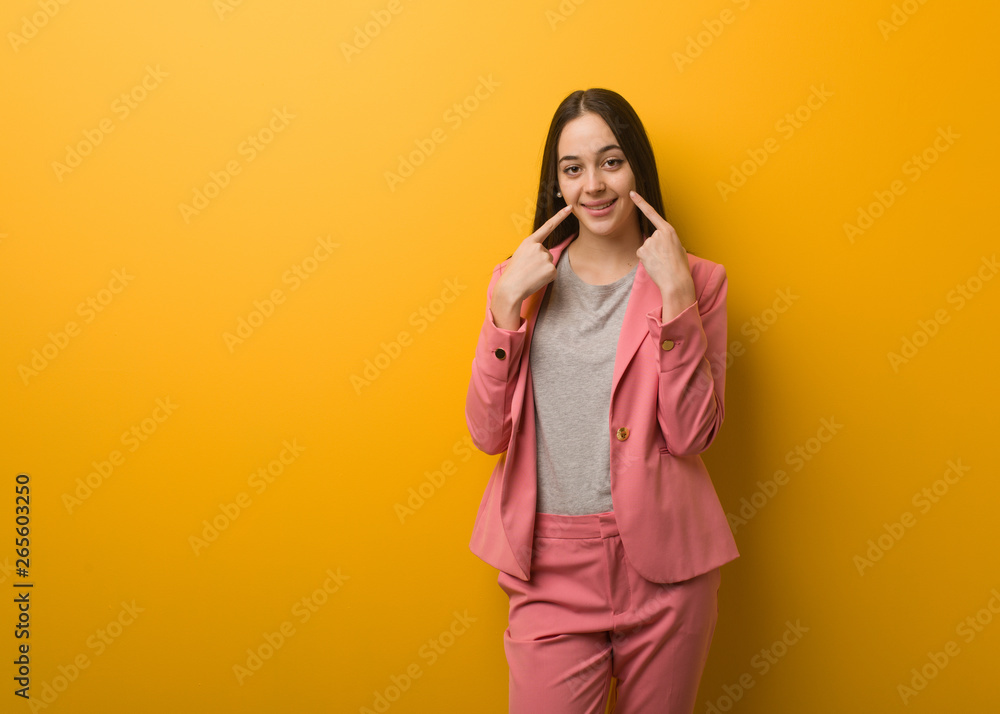 Young modern business woman smiles, pointing mouth Young modern business woman smiles, pointing mouth