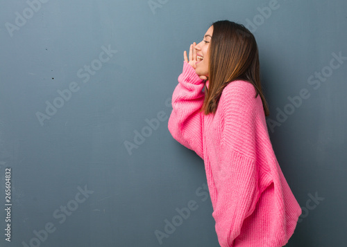 Young modern woman whispering gossip undertone photo