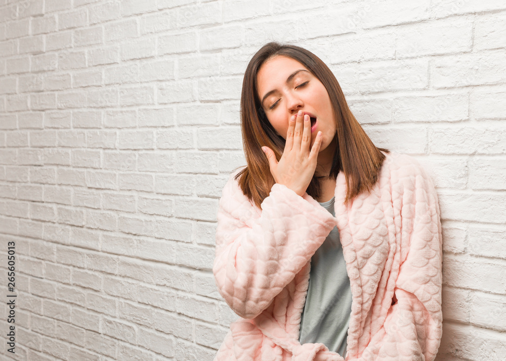 Young woman wearing pajama tired and very sleepy Young woman wearing pajama tired and very sleepy