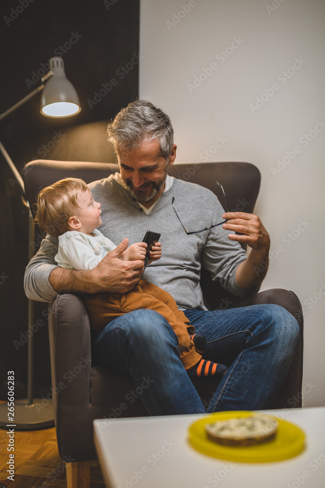 granddad and his grandson using tablet at home granddad and his grandson using tablet at home