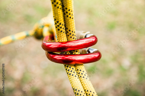 Cuadro en lienzo secure fastening of the rope to the climbing carabiner, carabiner in focus