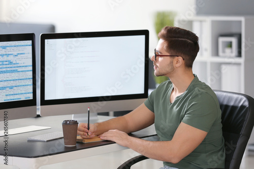 Male programmer working in office