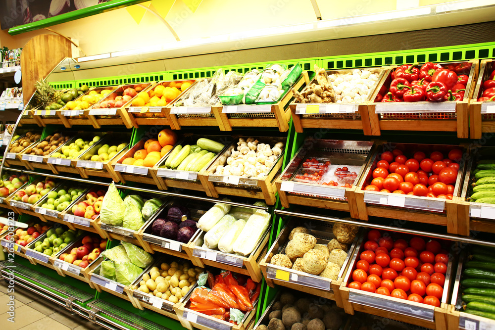 Various fresh vegetables and fruits in supermarket