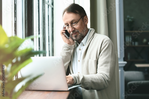 Handsome mature man working...