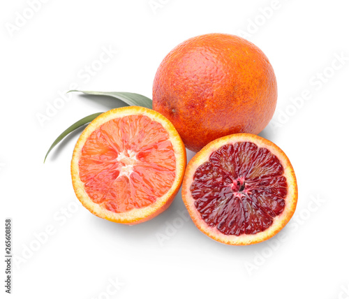 Tasty blood oranges on white background